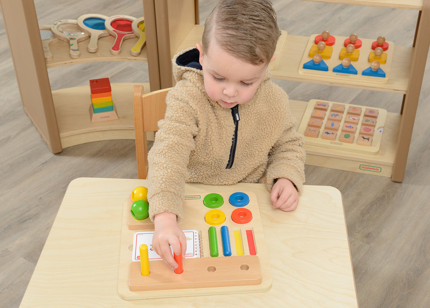 Stacking Pegs, Rings and Spheres