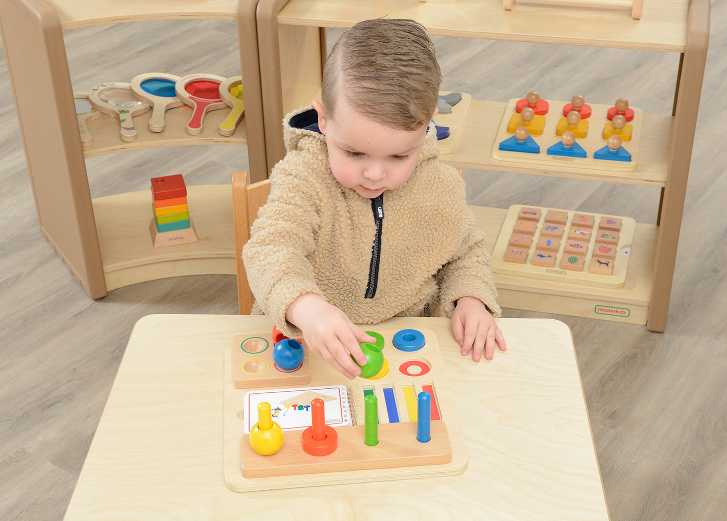 Stacking Pegs, Rings and Spheres