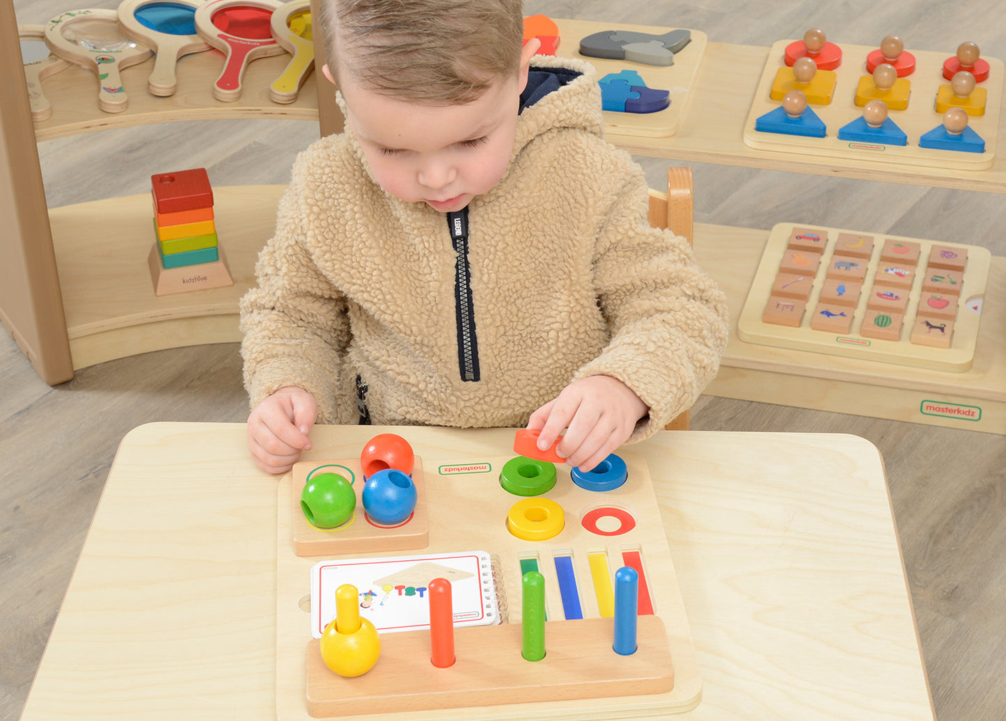 Stacking Pegs, Rings and Spheres