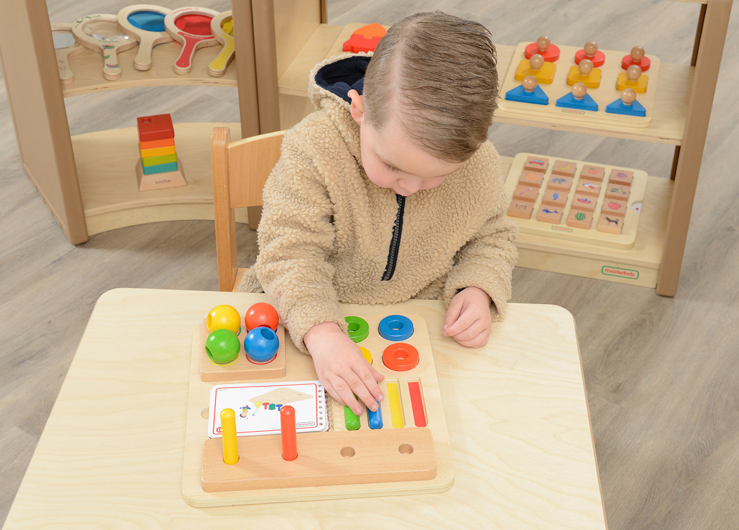 Stacking Pegs, Rings and Spheres